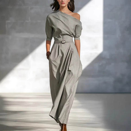 Elegantes graues Damen Maxikleid mit asymmetrischem One-Shoulder-Design und langen Ärmeln, bodenlang und stylish.