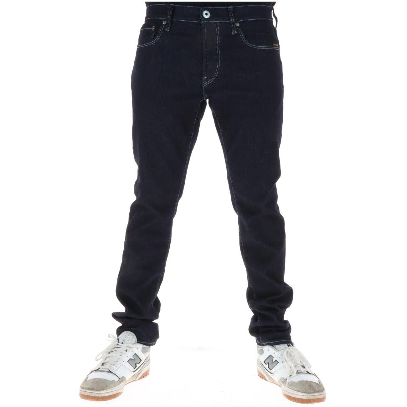 G-star Herren Jeans in a classic fit, showcasing a stylish dark wash and detailed stitching on the back pockets.